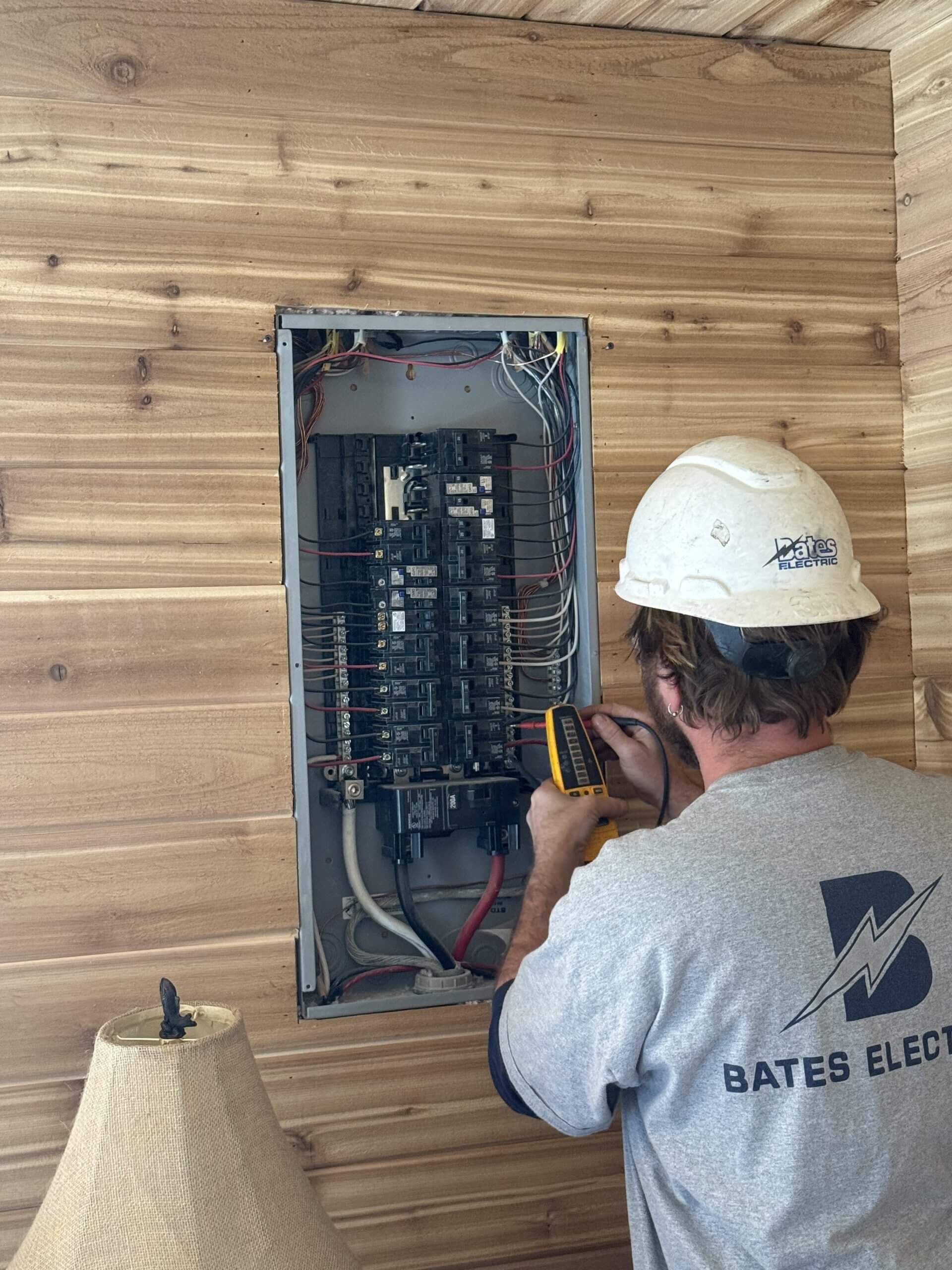 Bates Electric electrician troubleshooting a residential electrical panel in St. Louis